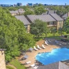 aerial view of a swimming pool and a city in the background