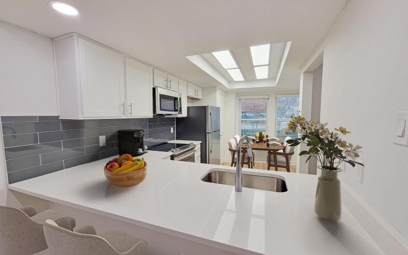 a kitchen with a table and chairs