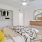 a bedroom with a bed and a fan