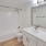 a bathroom with a tub sink and toilet