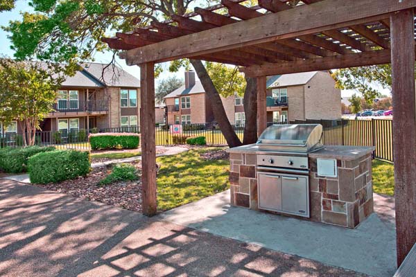 Grilling station near one of the many available pools at the apartment community.