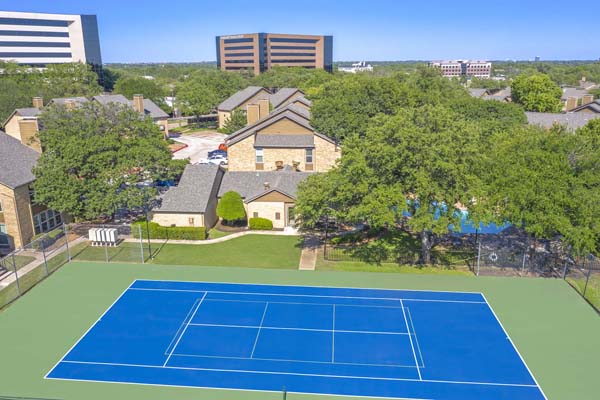 Tennis/ pickleball court that is conveniently located next to the leasing office/ community clubhouse.