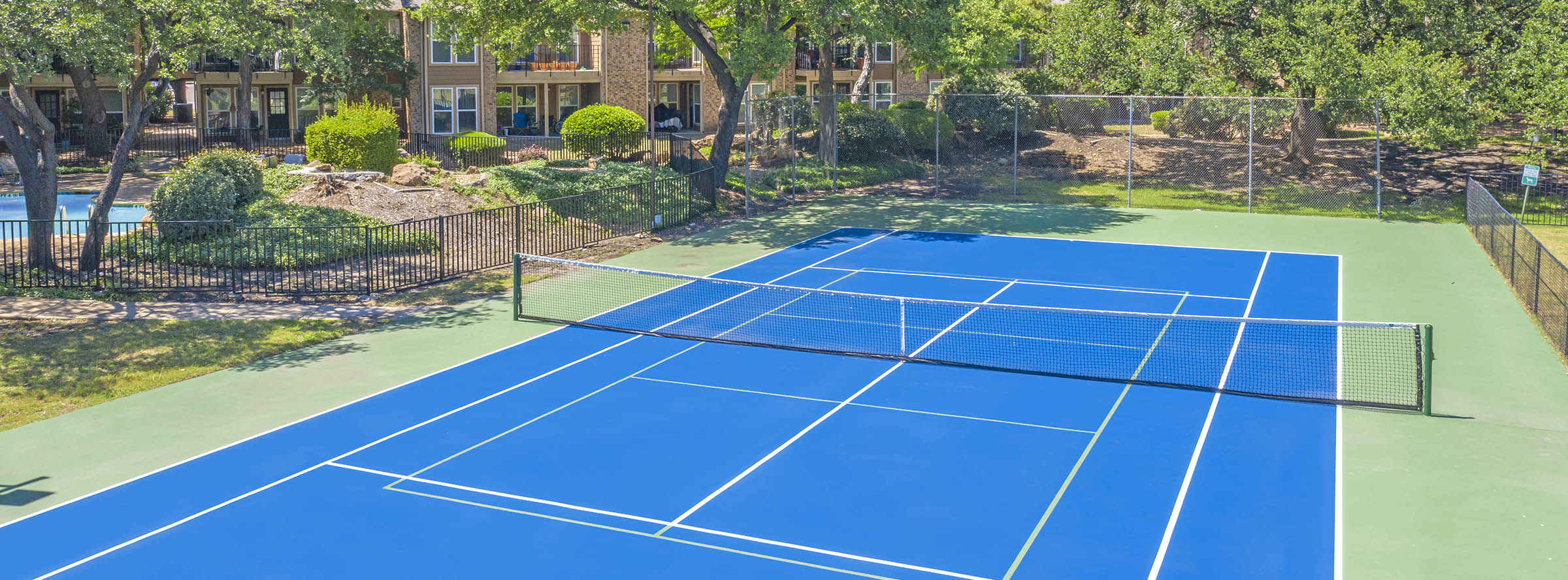Well-maintained tennis/ pickleball court.